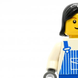 Female in blue overalls